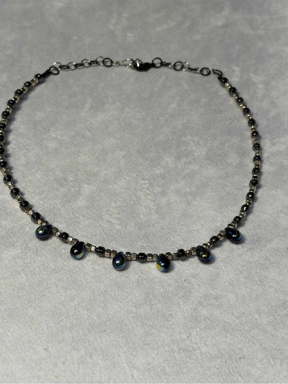 Iridescent Black Beaded Choker Necklace with Teardrop Accents